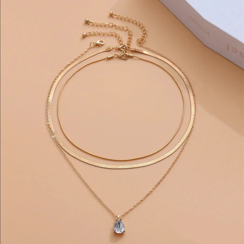 Raylee – Collier avec pendentif en zircone dorée superposée